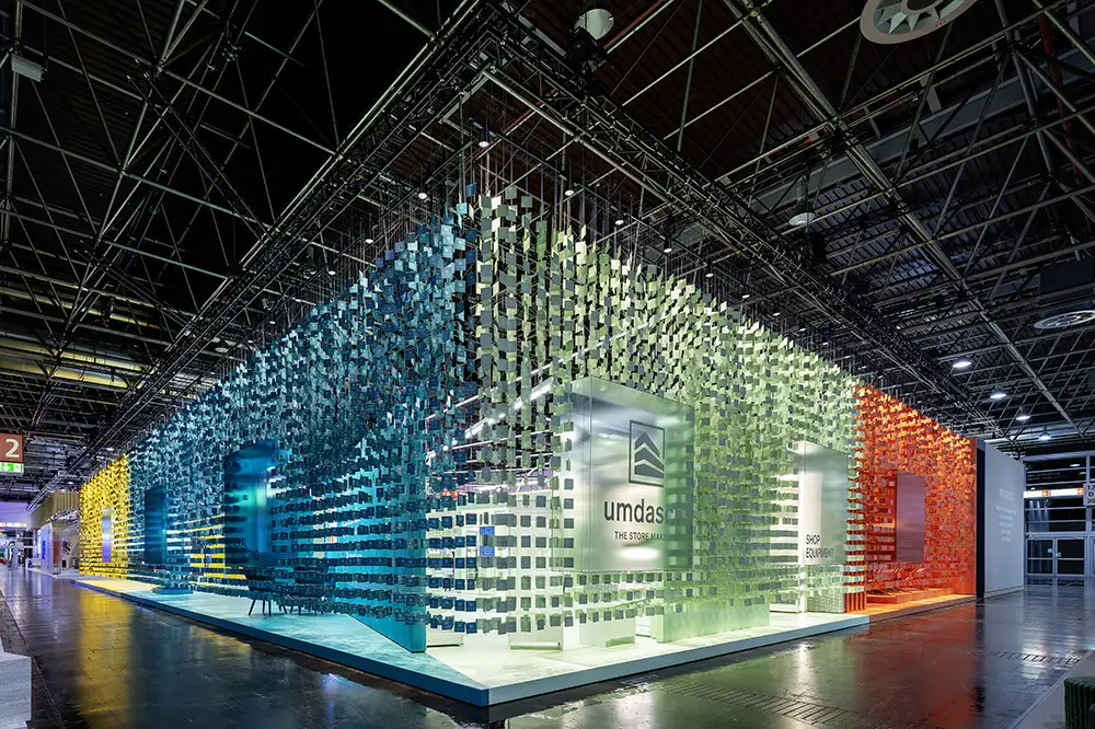 EuroShop 2026 Colours of Retail stand exterior featuring a multicolour tile façade installation in Düsseldorf exhibition hall.