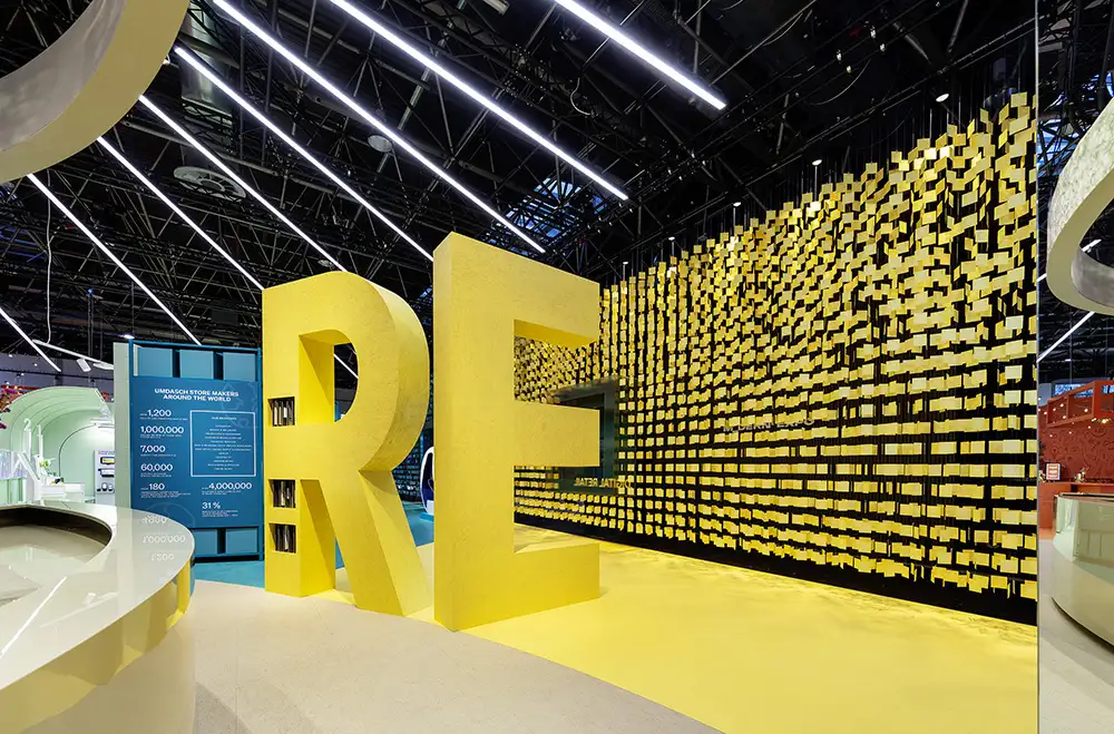EuroShop 2026 exhibition stand by umdasch The Store Makers featuring colourful tile façade and bold retail design elements.