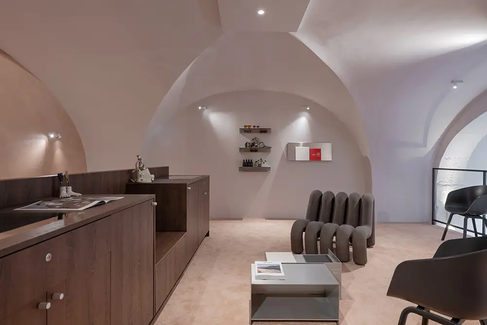 Arched boudoir lounge area inside LOULOU new optical store Lyon