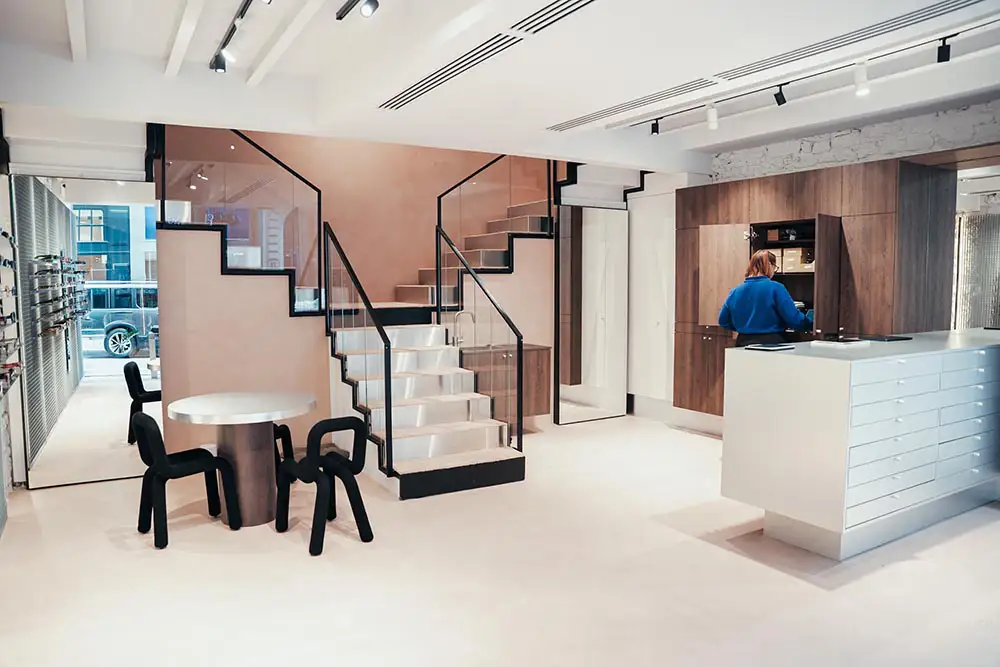Customer service moment inside quiet luxury eyewear boutique Lyon