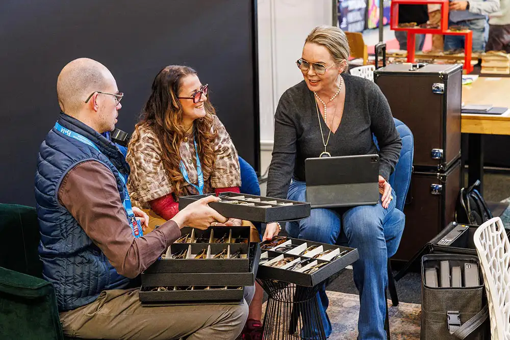 Opticians and exhibitors discussing orders and collections at Bold Light 2026 during Bold Light Den Bosch at Bold Optical Fair Netherlands.