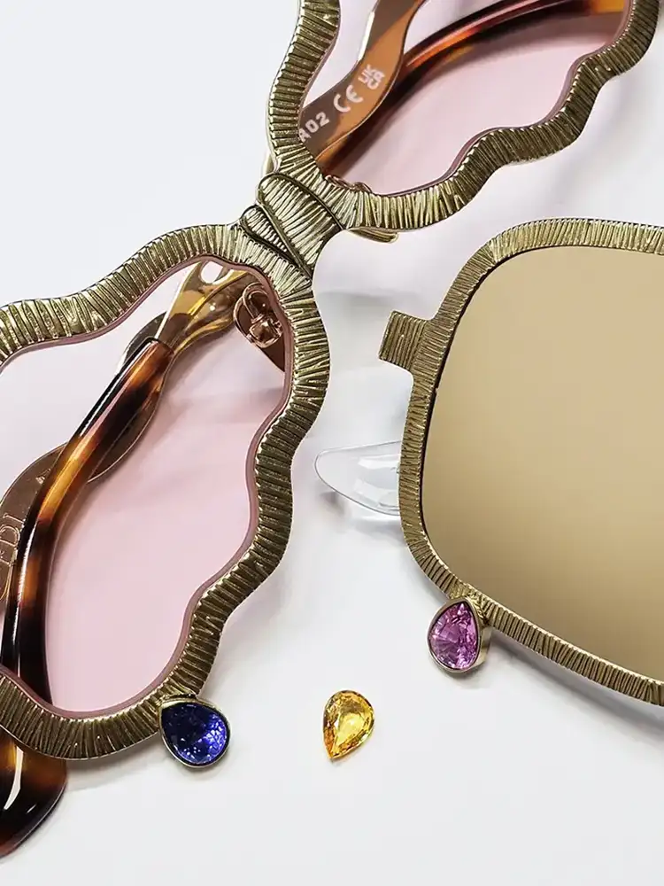 fine jewellery eyewear gold frame with sapphire ruby and gemstone detailing close up
