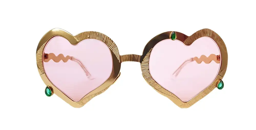 Francis de Lara NOW Awards 2026 heart frame with pink lenses and green gemstones