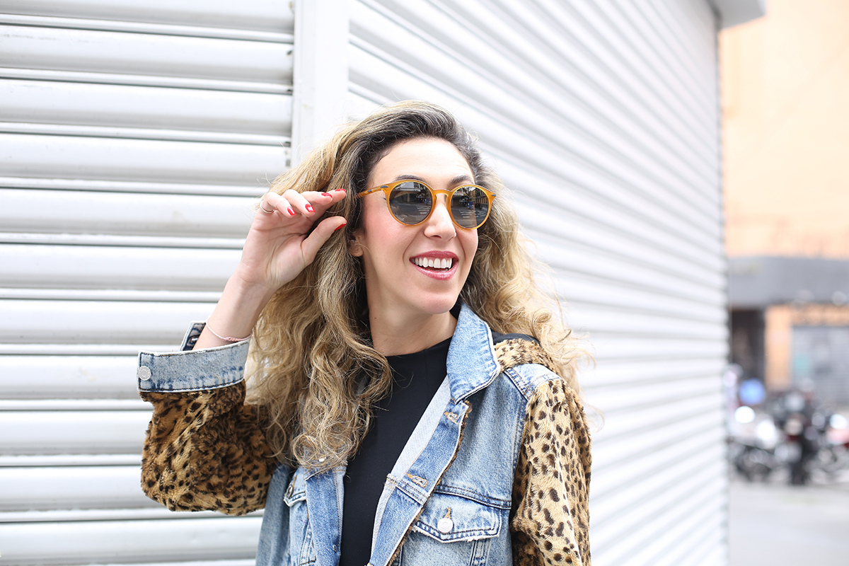 Chantal Goldfinger adjusting Serengeti Leonora sunglasses during lifestyle shoot