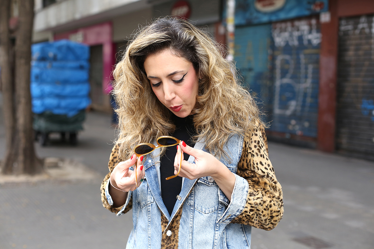 Chantal Goldfinger holding Serengeti Leonora sunglasses showcasing panto eyewear shape